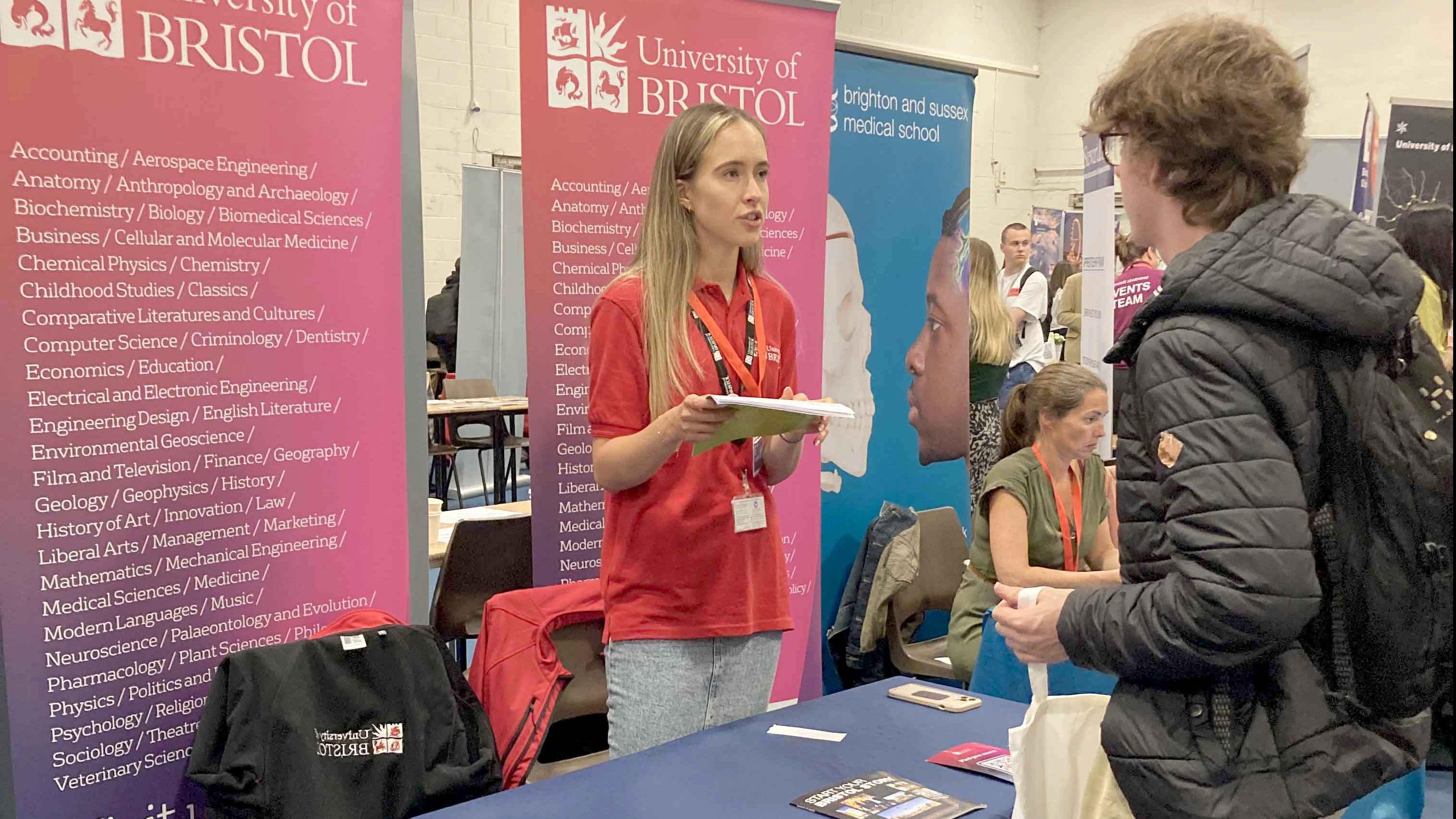 A student visiting a stand at The Sixth Form College Farnborough Moving On Day