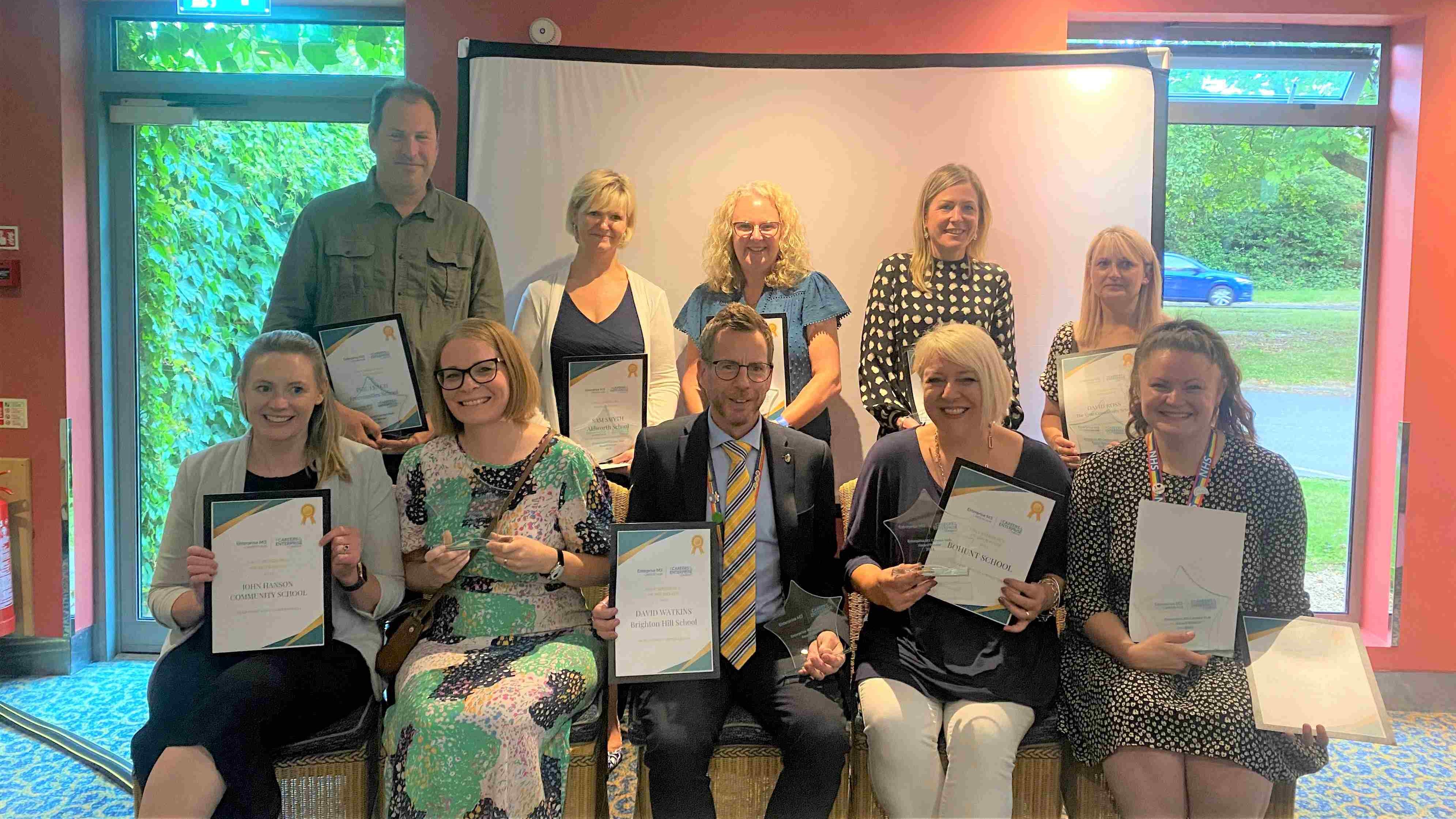 Group of award winners holding their certificates