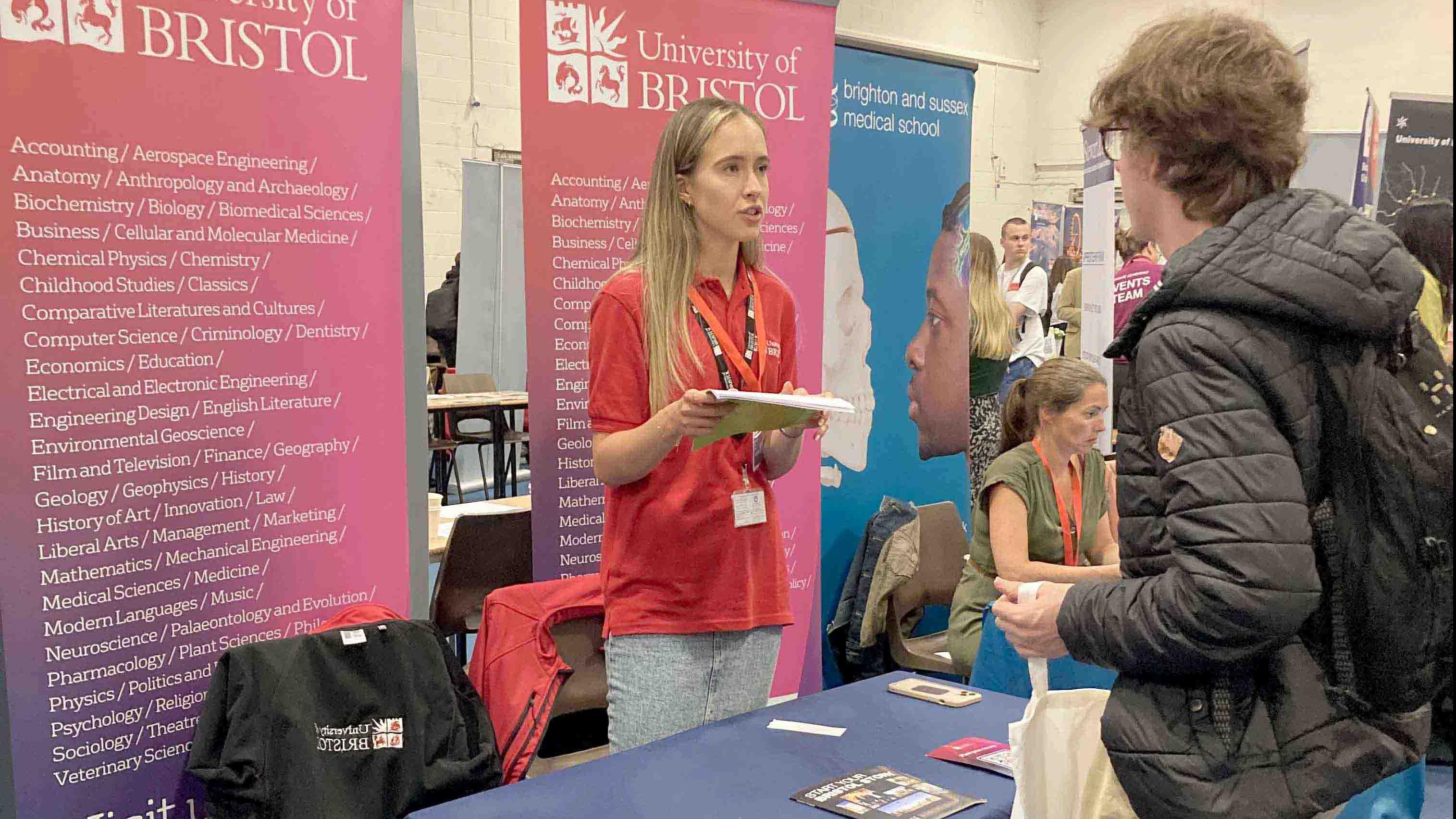 A student visiting a stand at The Sixth Form College Farnborough Moving On Day